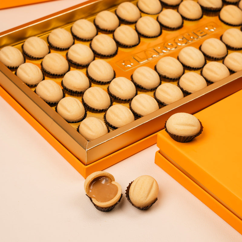 Premium Ain Al Jamal sweets from Laroche in luxury orange packaging